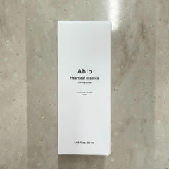 Abib Heartleaf Essence in-use on face during calming skincare routine