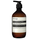 Aesop Eleos Nourishing Body Cleanser bottle pouring rich lather for hydrated skin