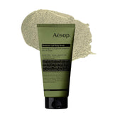 Aesop Geranium Leaf Exfoliating Body Scrub bottle pour promotes refreshing cleansing ritual.