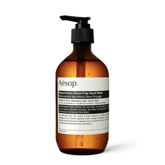 Aesop Resurrection Rinse-Free Hand Wash bottle on shelf for quick, waterless cleansing.