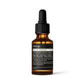 Aesop Shine Oil bottle close-up showing silicone-free hydration for smoother hair.