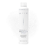 AIIR Flexible Hold Hairspray bottle closeup showing weightless hold and shine.