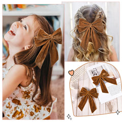 Aileam brown velvet bow clip worn with hats for versatile styling.