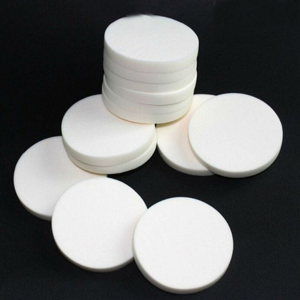 AKOAK round powder puff in white, soft sponge for smooth, even makeup application.