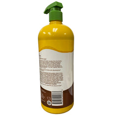 Alba Botanica More Moisture Shampoo coconut milk bottle on shelf signals gentle care and value.