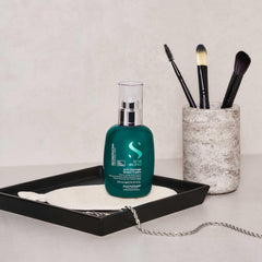 Alfaparf Milano reconstruction cream application shot emphasizes color-safe care