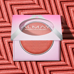 Almay Healthy Hue blush 200 So Peachy cheek swatch reveals buildable color.