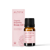 Alteya Organics rose oil bottle pour promotes aromatherapy and skincare benefits.