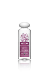 Alteya Rose Water bottle pours for refreshing facial toning and skin hydration.