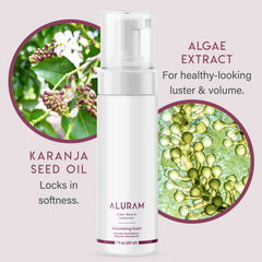 ALURAM Coconut Water Volumizing Foam being applied to hair for fluffy volume and texture.