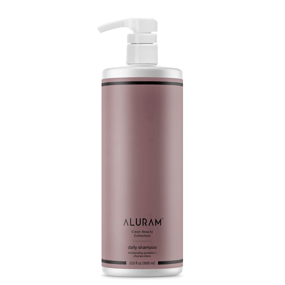 ALURAM Coconut Water Daily Shampoo bottle showing a hydrating formula for all hair types.