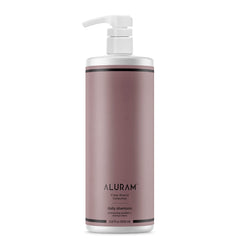 ALURAM Coconut Water Daily Shampoo bottle showing a hydrating formula for all hair types.