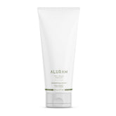 ALURAM Coconut Water Smoothing Cream bottle closeup showcases frizz control and lightweight smoothing.