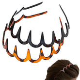 Amber-Black reversible headband teeth close-up shows dual-wear style