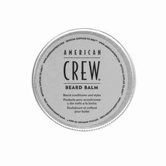 American Crew Beard Balm packaging on travel-friendly container for on-the-go grooming.