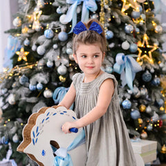 AMYDECOR royal blue bow on ponytail highlights hair while staying put.