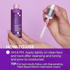 Andalou Naturals serum dropper dispensing a precise amount for targeted application.