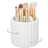 Anyoifax 360 rotating makeup brush holder with seven slots for organized vanity brushes.