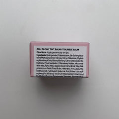 AOU GLOWY TINT BALM application on lips for daily color and moisture.