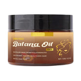 Apolo Batana Oil bottle pouring for easy application and lightweight nourishment