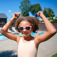 Kid at pool day after AQUA GUARD applied with smoother hair and fewer tangles.
