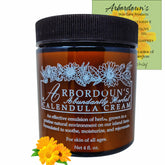 Arbordoun Calendula Cream amber jar close-up for soothing tattoos and eczema.