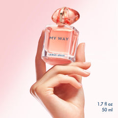 Armani Beauty My Way Ylang coral bottle on desk evokes an uplifting vibe.