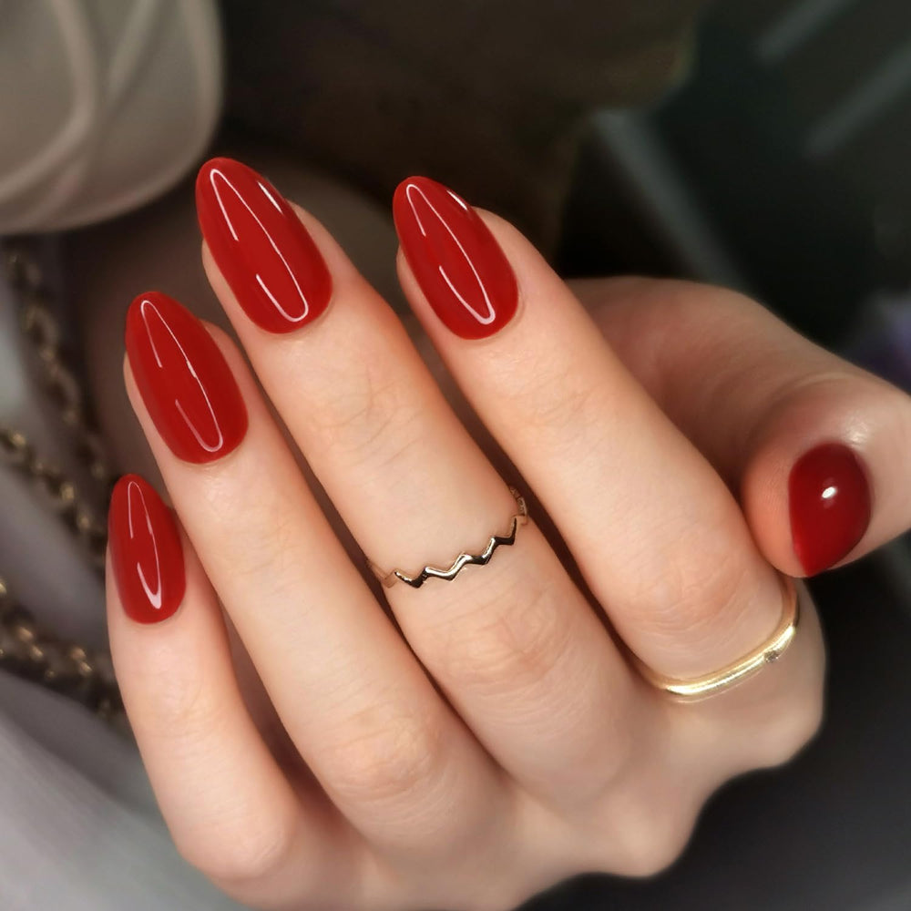 Artquee red almond press-on nails kit; 30 pieces and 15 sizes for a precise fit.