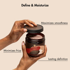 As I Am Twist Defining Cream Red on hand applying for smooth curl control.