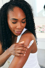 ASUTRA Magnesium Body Butter Lotion applied to skin for hydrating relief.