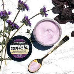 Aunt Jackie's Curl La La Custard on braid-out for lasting definition.