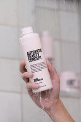 Authentic Beauty Concept Glow Conditioner hair strands show smooth, shiny texture after use.
