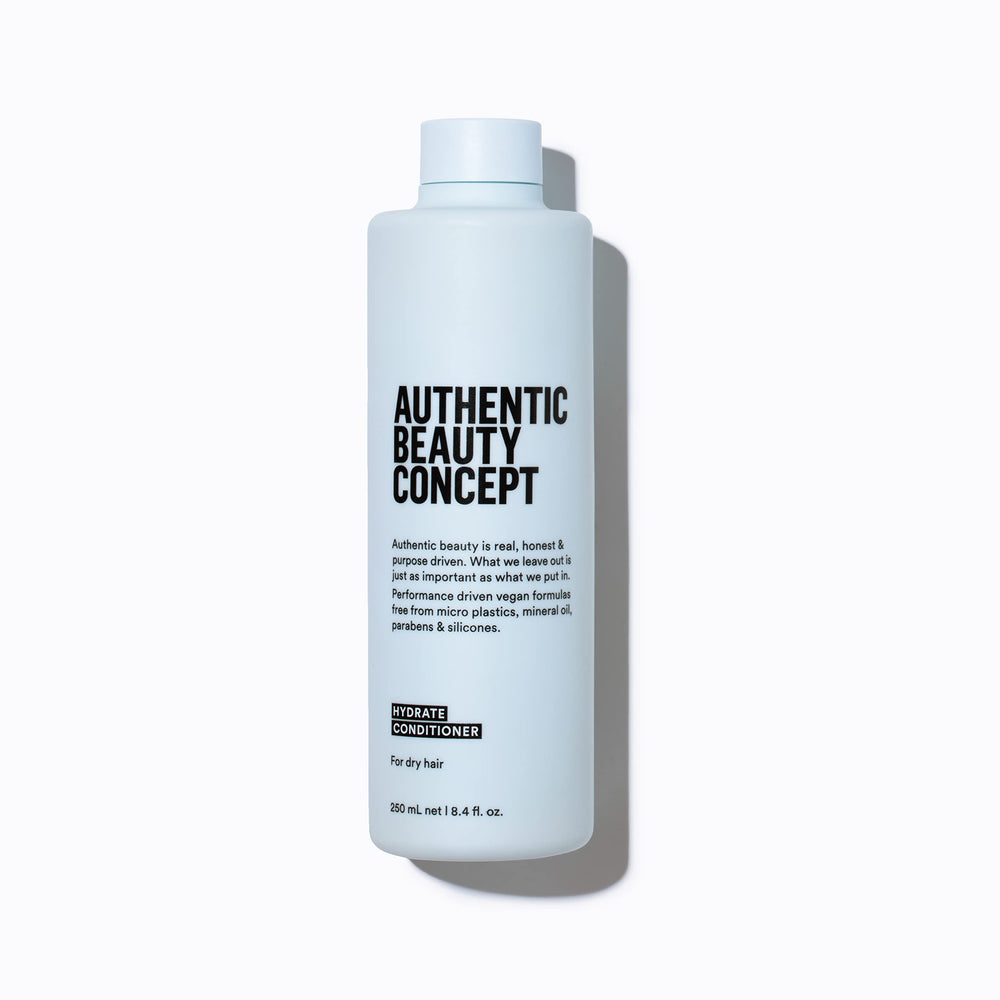 Authentic Beauty Concept Hydrate Conditioner bottle front shows lightweight moisture for dry and curly hair