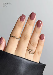AutyaMee Fall Mauve gel strips in hand ready for easy application.