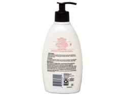 Aveeno Creamy Oil oats and sesame ingredients highlighted for nourishing skin.