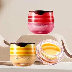 Axnzp honey-pot lip balm jar closeup highlights natural honey and strawberry extracts for hydration