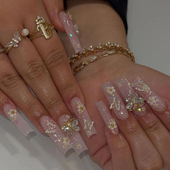 BABALAL square press-on nails in long pink glitter with butterfly charms for quick glam.