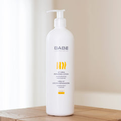 Close-up texture of Babe Laboratorios lotion showing creamy, moisturizing consistency