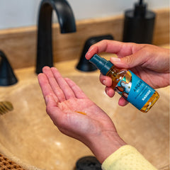 Badger Argan Hair Oil application shows leave-in conditioning for soft, manageable hair.