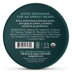 Badger beard balm in hands illustrating easy, non-greasy styling and tame