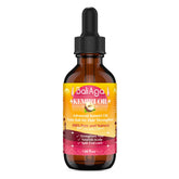 Bali Aga Kemiri Oil bottle pour shows nourishing hair support.