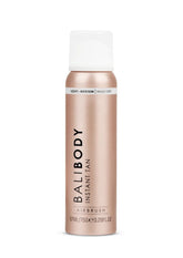BALI BODY Instant Tan bottle spray demonstrates fast, even bronze mist for a quick glow.