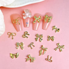 BANA ART gold bow charms close-up demonstrates small size for delicate nail accents.