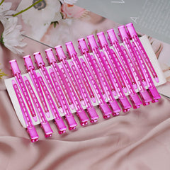 Bantoye bright pink clips arranged for salon and home use packaging.
