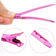 Bantoye bright pink duck bill clip used during styling to hold hair securely.