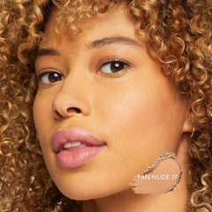 bareMinerals Original loose powder foundation Tan Nude 17 application shot shows buffing for even skin tone.