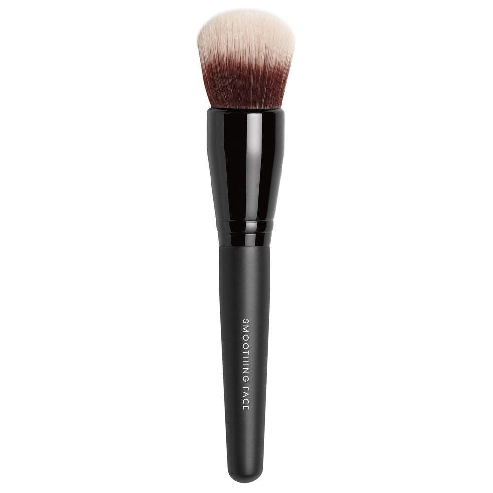 BareMinerals Smoothing Face Brush close-up highlighting dual-fiber bristles for soft diffusion.