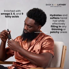 Bask & Lather Beard Magic Growth Oil in hand for easy application and nourishment