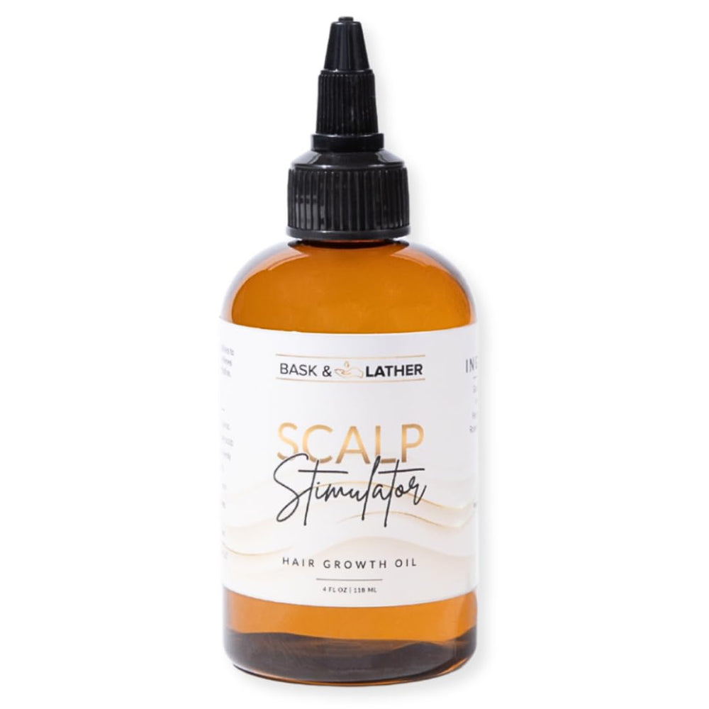 Bask & Lather scalp stimulator bottle close-up showing natural oils for growth support