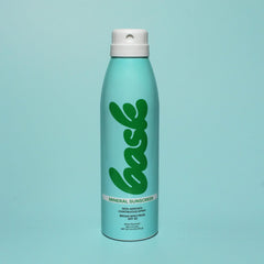 Bask Suncare fragrance-free spray demonstrates gentle application for sensitive skin.
